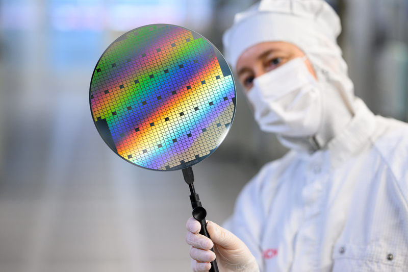 Bosch employee holding SiC chip